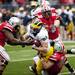 Michigan tight end Mike Kwiatkowski is tackled by Ohio State defense in the first half on Saturday. Daniel Brenner I AnnArbor.com